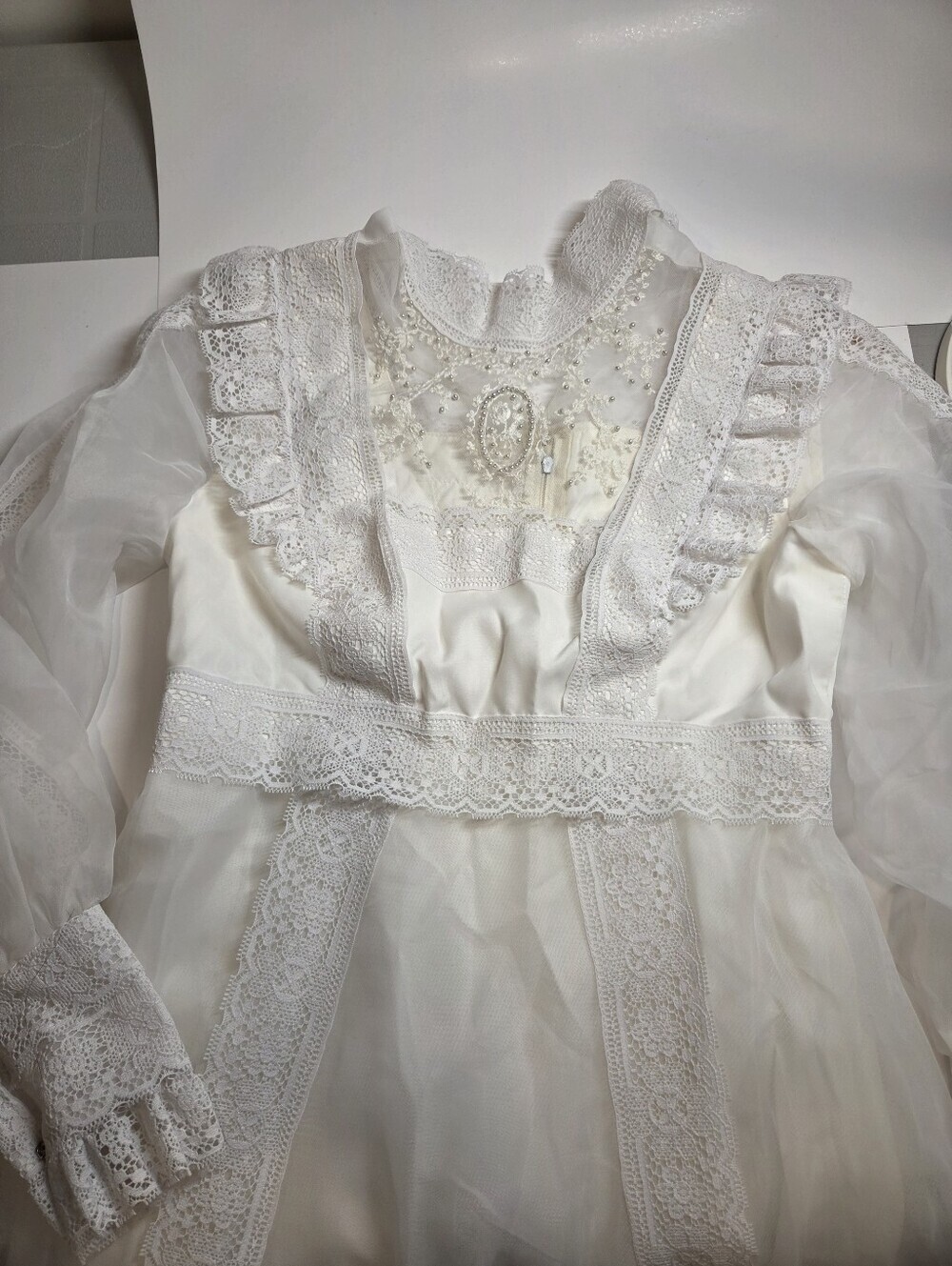 Victorian-Inspired White Lace Bridal Gown with High Neck and Sheer Puff Sleeves - Picture 3 of 13